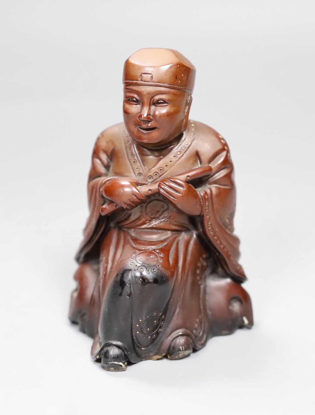 A Chinese composition figure of a seated musician, 12cms high